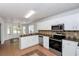 Kitchen with white cabinets, stainless steel appliances at 80 Stewart Hollow Ln, Covington, GA 30016