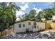 White house back with a wooden fence and landscaping at 1614 Abner Nw Ter, Atlanta, GA 30318