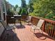 Relaxing deck with wooden flooring and outdoor seating at 3717 Lockerbie Ln, Powder Springs, GA 30127