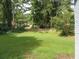Large backyard with trees and grass at 2585 Westchester Dr, Atlanta, GA 30344