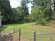 Large backyard with a chain link fence at 2585 Westchester Dr, Atlanta, GA 30344