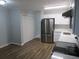 Updated kitchen with white cabinets and stainless steel appliances at 2585 Westchester Dr, Atlanta, GA 30344