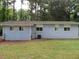 Light blue house exterior with a yard at 2585 Westchester Dr, Atlanta, GA 30344