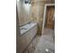 Bathroom with white cabinets, granite countertops, and marble-look vinyl flooring at 3600 Grady Smith Rd, Loganville, GA 30052