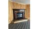 Brick fireplace with dark wood mantel and raised hearth at 3600 Grady Smith Rd, Loganville, GA 30052