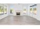 Living room with hardwood floors, fireplace and multiple windows at 6051 Stallion Rdg, Douglasville, GA 30135