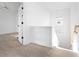 Upstairs hallway with light flooring and access to bedrooms at 6051 Stallion Rdg, Douglasville, GA 30135