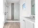 Bathroom with a large walk-in shower and herringbone tile feature at 6051 Stallion Rdg, Douglasville, GA 30135