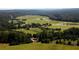 Aerial view of vast green fields and forests at 6051 Stallion Rdg, Douglasville, GA 30135