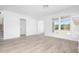 Living area with hardwood floors and large windows offering natural light at 6051 Stallion Rdg, Douglasville, GA 30135