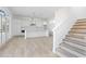 Open kitchen with white cabinets and a large island at 6051 Stallion Rdg, Douglasville, GA 30135