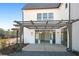 Covered patio with pergola and French doors leading inside at 6051 Stallion Rdg, Douglasville, GA 30135