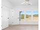 Bright bedroom with large windows and hardwood floors at 6051 Stallion Rdg, Douglasville, GA 30135