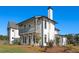Two-story home with white siding, gray accents, and a balcony at 6001 Stallion Rdg, Douglasville, GA 30135