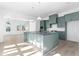 Modern kitchen with light blue cabinets, quartz countertops, and an island at 6001 Stallion Rdg, Douglasville, GA 30135