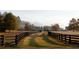 Long driveway leading to the property through pastures at 6001 Stallion Rdg, Douglasville, GA 30135