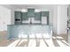Modern kitchen with stainless steel appliances and light green cabinets at 6001 Stallion Rdg, Douglasville, GA 30135