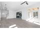 Open living room with hardwood floors and views into the kitchen at 6001 Stallion Rdg, Douglasville, GA 30135
