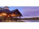 Elegant lakeside pavilion with seating and lighting, perfect for gatherings at 6001 Stallion Rdg, Douglasville, GA 30135