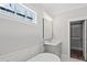 Elegant bathroom with soaking tub, a walk-in closet, and modern fixtures at 4006 Moody Ln, Woodstock, GA 30188