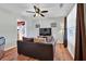 Living room featuring a brown leather sofa and a large TV at 101 Natalie Ct, Dallas, GA 30157