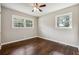 Well-lit bedroom featuring hardwood floors and neutral wall colors at 1554 Pine Ct, Conley, GA 30288