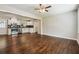 Spacious living room with dark hardwood floors and ceiling fan at 1554 Pine Ct, Conley, GA 30288