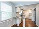 Renovated kitchen features granite countertops, white cabinets, and hardwood floors at 2836 Harlan Dr, Atlanta, GA 30344