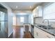 Modern kitchen with granite countertops, stainless steel appliances, and white shaker cabinets at 2836 Harlan Dr, Atlanta, GA 30344