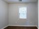 Simple bedroom with hardwood floors and a window with blinds at 2836 Harlan Dr, Atlanta, GA 30344