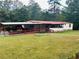 Ranch style home with red roof and carport at 35 Clayton Path, Douglasville, GA 30134