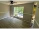 Bright bedroom with large window and ceiling fan at 435 Ridgedale Way, Lawrenceville, GA 30044