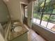Bathroom with double sinks, granite countertop, and view of a patio at 435 Ridgedale Way, Lawrenceville, GA 30044