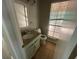 Updated bathroom with granite vanity and tiled floor at 435 Ridgedale Way, Lawrenceville, GA 30044