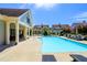 Relaxing community pool area with lounge chairs and adjacent clubhouse at 196 Foxtail Rd, Woodstock, GA 30188