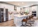 Modern kitchen with white cabinetry, stainless steel appliances, and large island at 738 Crossroad Ct, Powder Springs, GA 30127