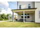 Covered patio with seating area, adjacent to house at 738 Crossroad Ct, Powder Springs, GA 30127