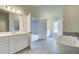 Elegant bathroom featuring a double vanity and free-standing tub at 201 Haverling Pass, Hampton, GA 30252
