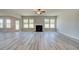 Gathering room with a fireplace and access to backyard at 201 Haverling Pass, Hampton, GA 30252