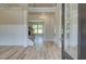 Bright and spacious entryway with wood-look flooring and views to the Gathering room at 201 Haverling Pass, Hampton, GA 30252