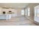 Modern kitchen with white cabinets and an island at 201 Haverling Pass, Hampton, GA 30252