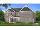 Two-story brick home with side-load garage and landscaping at 201 Haverling Pass, Hampton, GA 30252