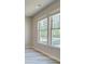 A bright breakfast nook with a view of the backyard at 201 Haverling Pass, Hampton, GA 30252