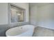 Bathroom with a large soaking tub and a separate shower at 201 Haverling Pass, Hampton, GA 30252