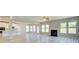 Open floor plan Gathering room with fireplace and kitchen views at 201 Haverling Pass, Hampton, GA 30252