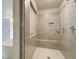 Walk-in shower with bench seating and tiled walls at 201 Haverling Pass, Hampton, GA 30252