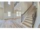 Stunning staircase with wrought iron railing and wooden steps at 201 Haverling Pass, Hampton, GA 30252