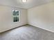 Bedroom with carpet and large window at 9105 Sterling Lakes Cir, Covington, GA 30014