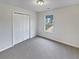 Bright bedroom with carpet and a window at 9105 Sterling Lakes Cir, Covington, GA 30014