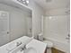 Clean bathroom with white vanity and shower/tub combo at 9105 Sterling Lakes Cir, Covington, GA 30014